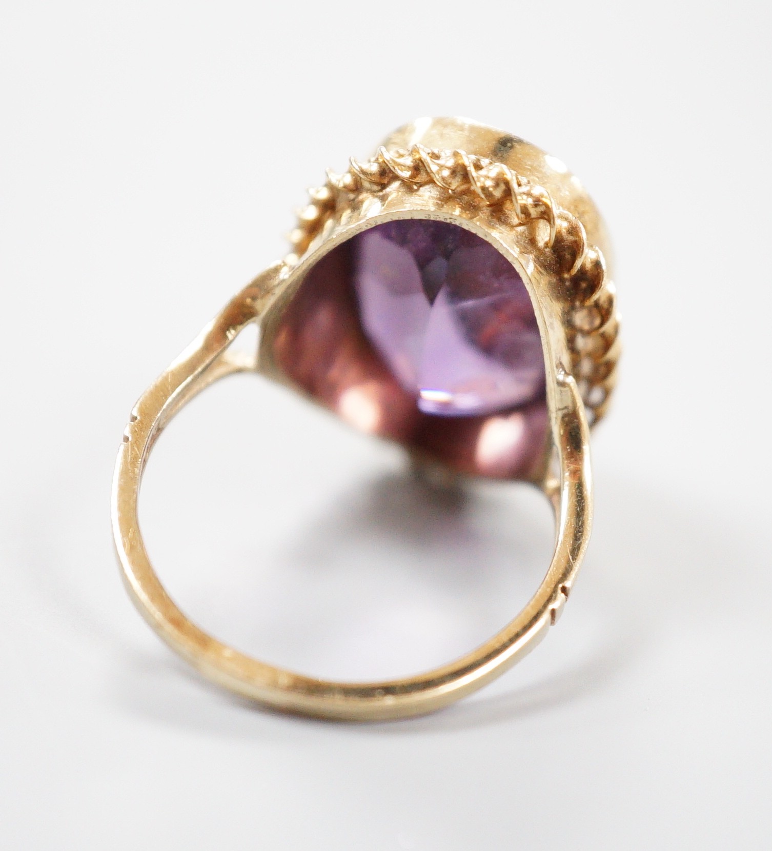 A 1970's 9ct gold and amethyst set dress ring, size O/P gross weight 6.1 grams.